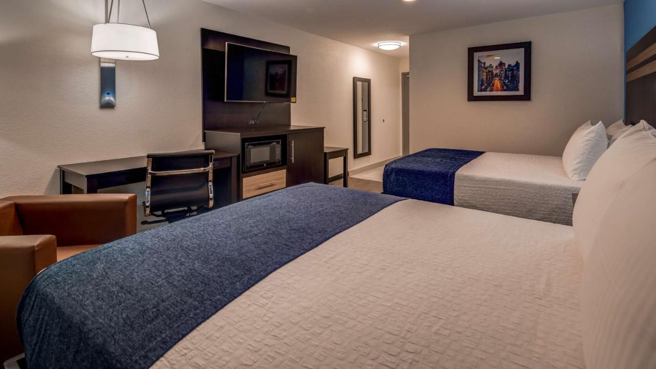 Queen Room with Two Queen Beds at SureStay Plus Hotel by Best Western Humble