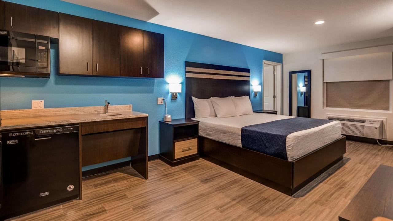 King Room with Roll-In Shower - Disability Access at SureStay Plus Hotel by Best Western Humble