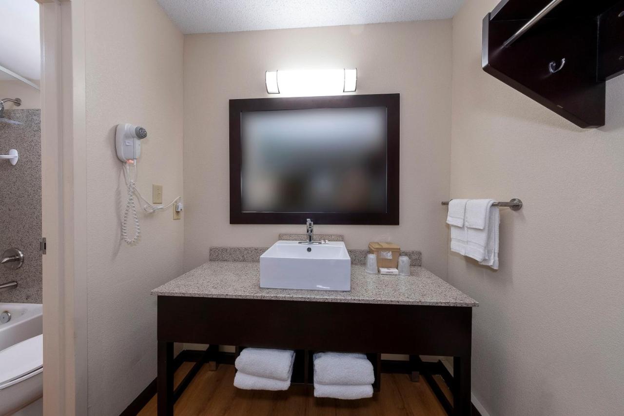 Premium King Room Disability Access Smoke Free (Upgraded Bedding & Snack Box) at Red Roof Inn PLUS+ Huntsville - Madison