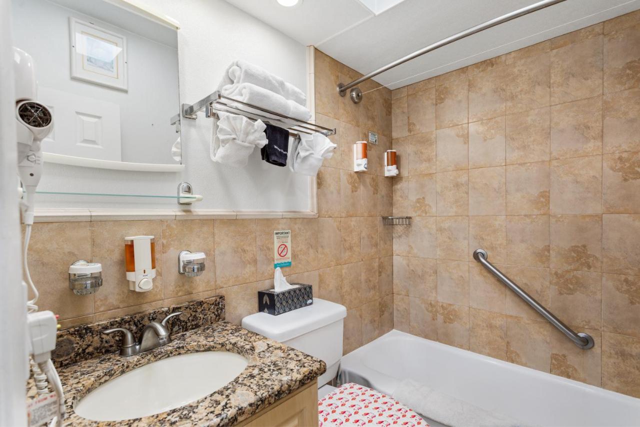 Deluxe One Bedroom Suite: 2 Queen Beds and 2 Sleeper Sofas at Bay Palms Waterfront Resort - Hotel and Marina