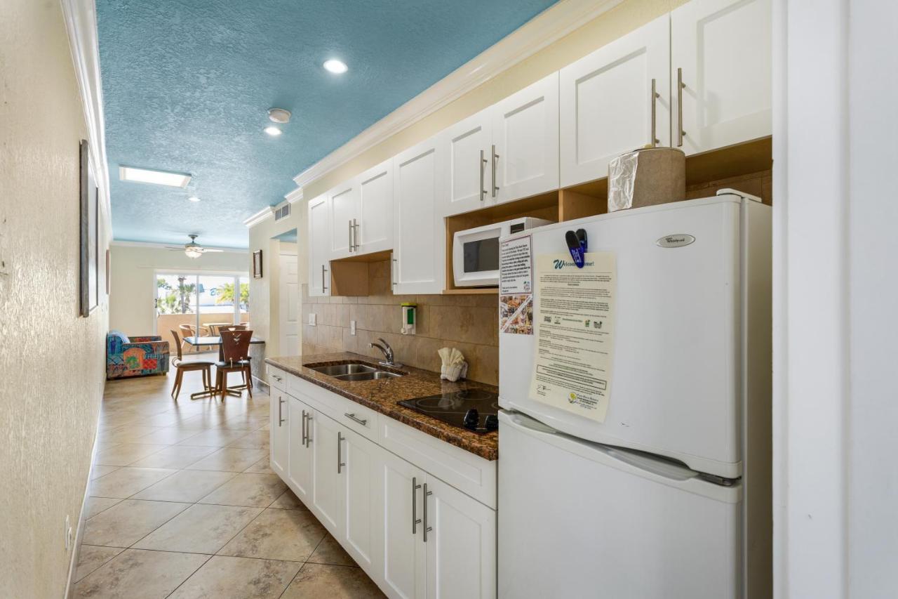 Deluxe One Bedroom Suite: 2 Queen Beds and 2 Sleeper Sofas at Bay Palms Waterfront Resort - Hotel and Marina