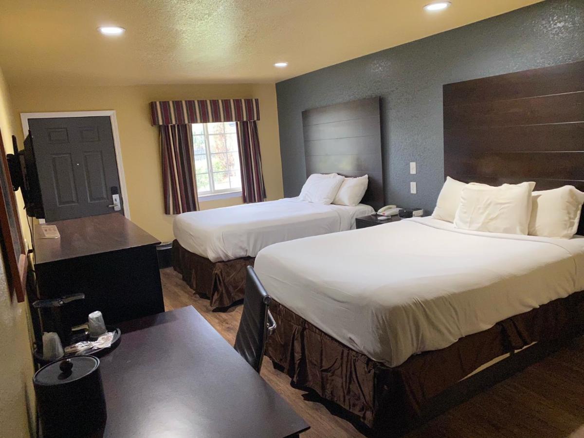 Queen Room with Two Queen Beds at Woodridge Inn and Suites