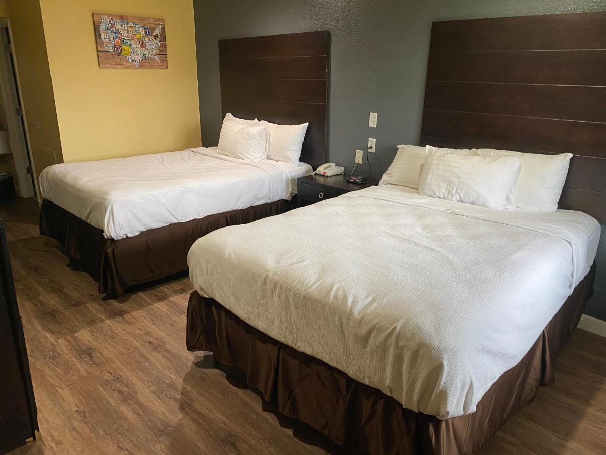 Queen Room with Two Queen Beds at Woodridge Inn and Suites