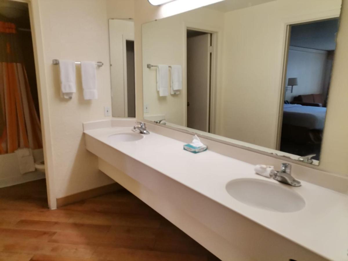 Two Bedroom Suite with One King and Two Queen Beds at Super 8 by Wyndham San Antonio Near SeaWorld Ingram Park