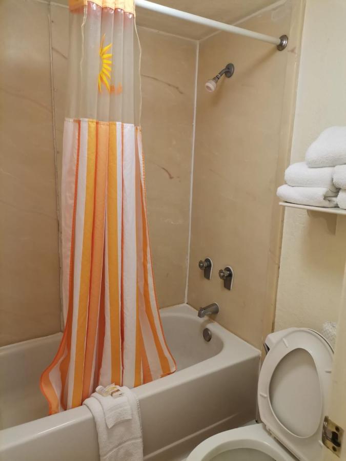 Two Bedroom Suite with One King and Two Queen Beds at Super 8 by Wyndham San Antonio Near SeaWorld Ingram Park