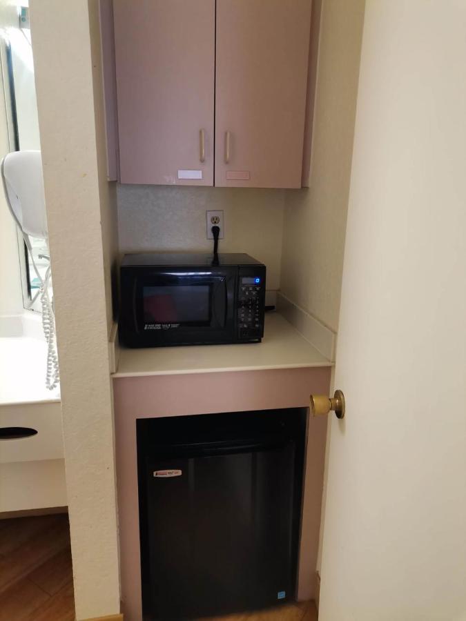 Two Bedroom Suite with One King and Two Queen Beds at Super 8 by Wyndham San Antonio Near SeaWorld Ingram Park
