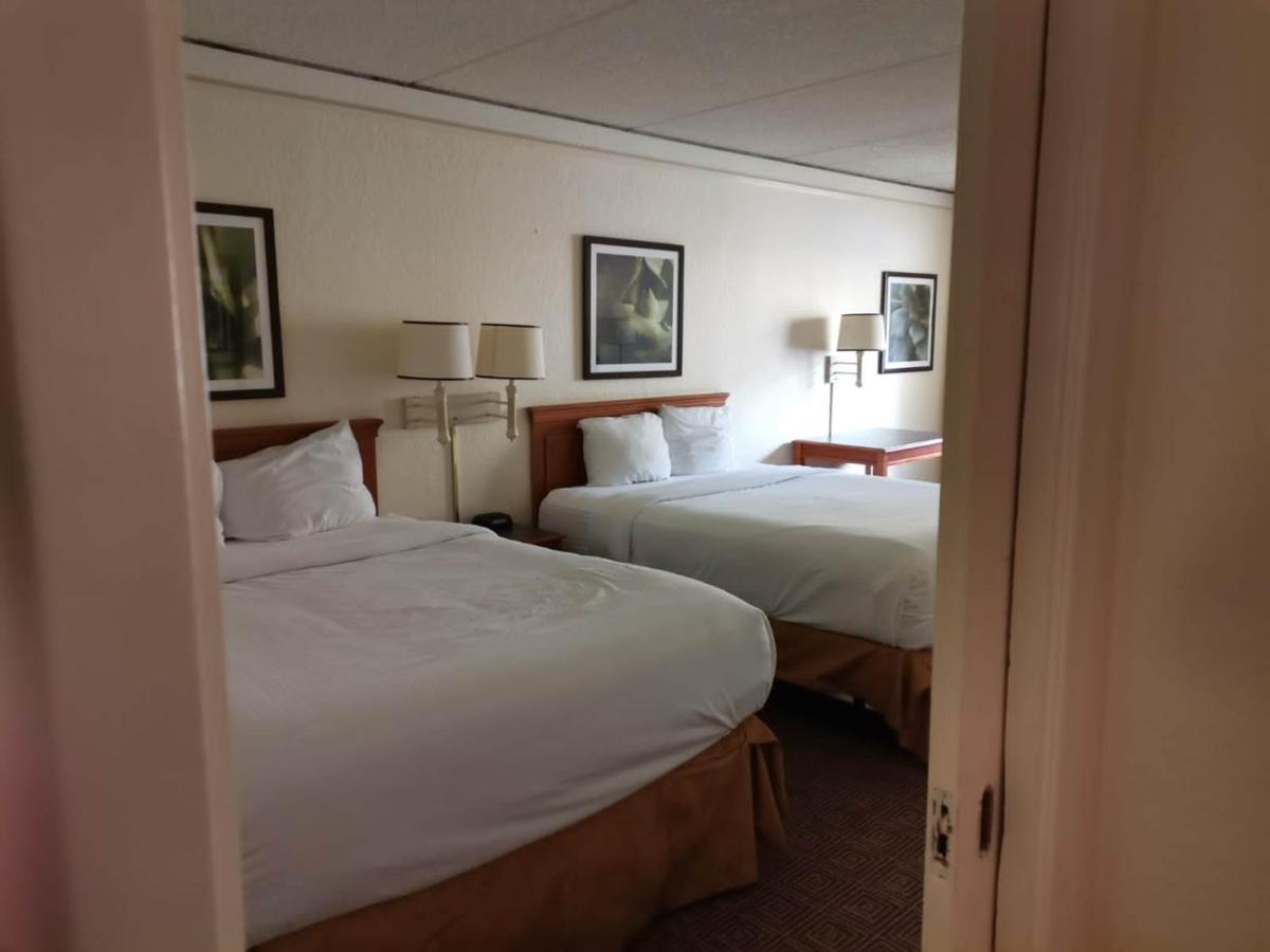 Two Bedroom Suite with One King and Two Queen Beds at Super 8 by Wyndham San Antonio Near SeaWorld Ingram Park