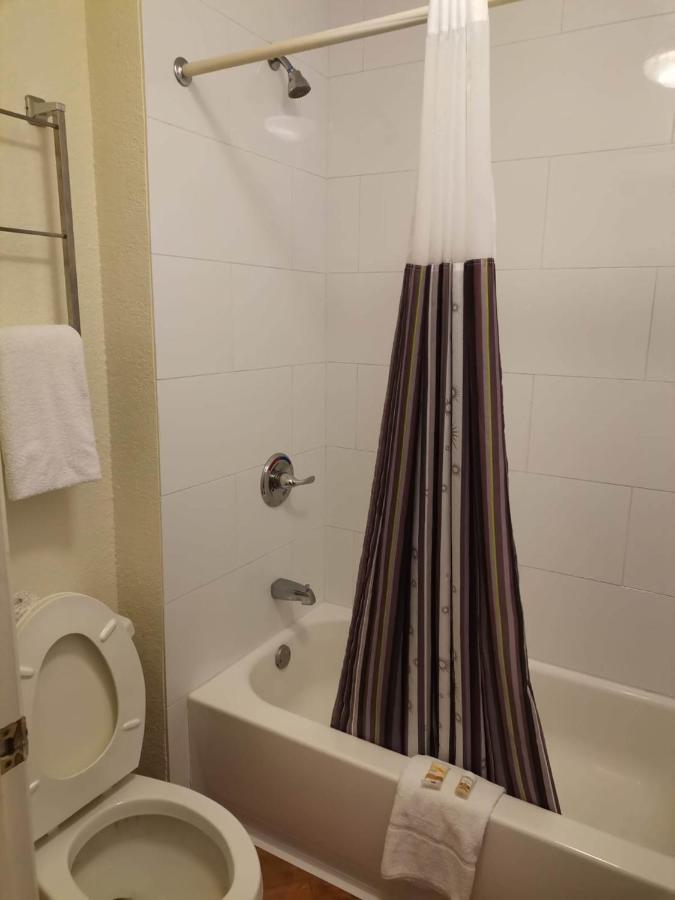 Two Bedroom Suite with One King and Two Queen Beds at Super 8 by Wyndham San Antonio Near SeaWorld Ingram Park