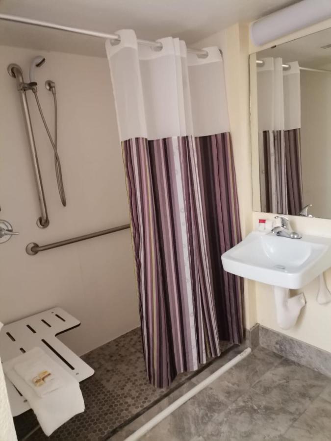 King Room with Roll-In Shower - Mobility/Hearing Accessible - Non-Smoking at Super 8 by Wyndham San Antonio Near SeaWorld Ingram Park