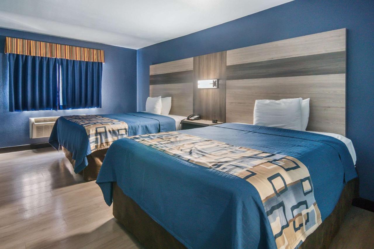 Efficiency Queen Room with Two Queen Beds - Accessible/Smoking at Rodeway Inn Carrollton I-35E