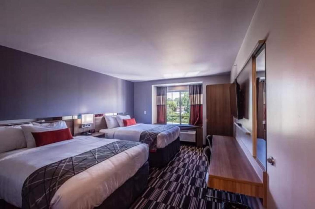 Queen Room with Two Queen Beds - Non-Smoking at Microtel Inn & Suites by Wyndham Amsterdam