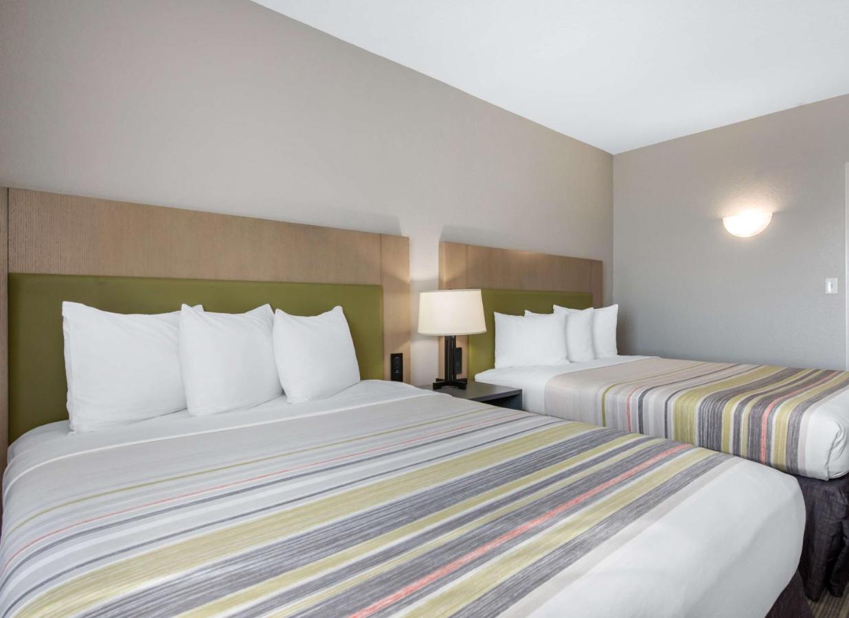 Queen Room with Two Queen Beds at Country Inn & Suites by Radisson, Port Canaveral, FL