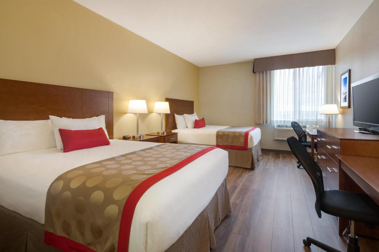 Pet Friendly Queen Room with Two Queen Beds - Non-Smoking at Bakken Airport XWA Hotel & Studios