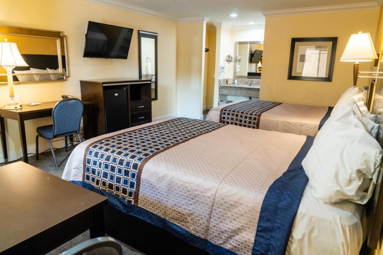 Queen Room with Two Queen Beds and Roll in Shower - Accessible/Non-Smoking at Rodeway Inn & Suites Colton - Riverside