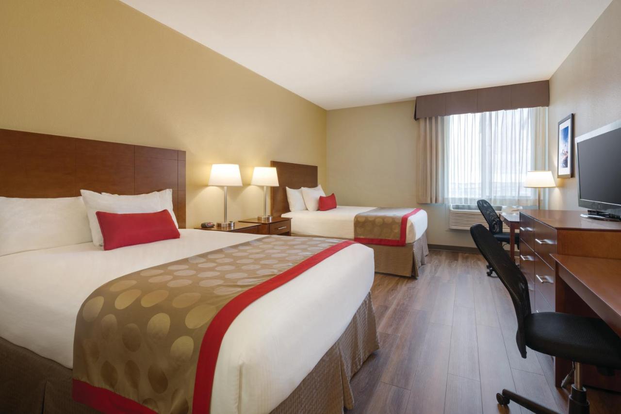 Pet Friendly Queen Room with Two Queen Beds - Non-Smoking at Bakken Airport XWA Hotel & Studios