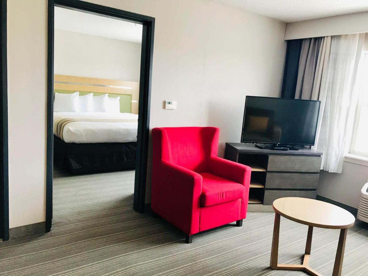 King Room with Sofa Bed at Country Inn & Suites by Radisson, Warner Robins, GA
