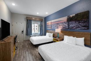 Room #586445610 at Days Inn & Suites by Wyndham Downtown/University of Houston