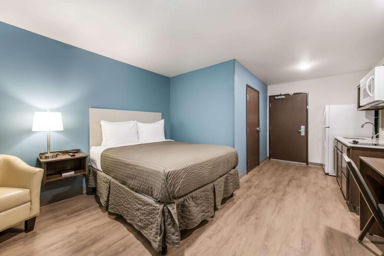 Queen Room with Roll-In Shower - Accessible/Non-Smoking at WoodSpring Suites Charlotte - University Research Park