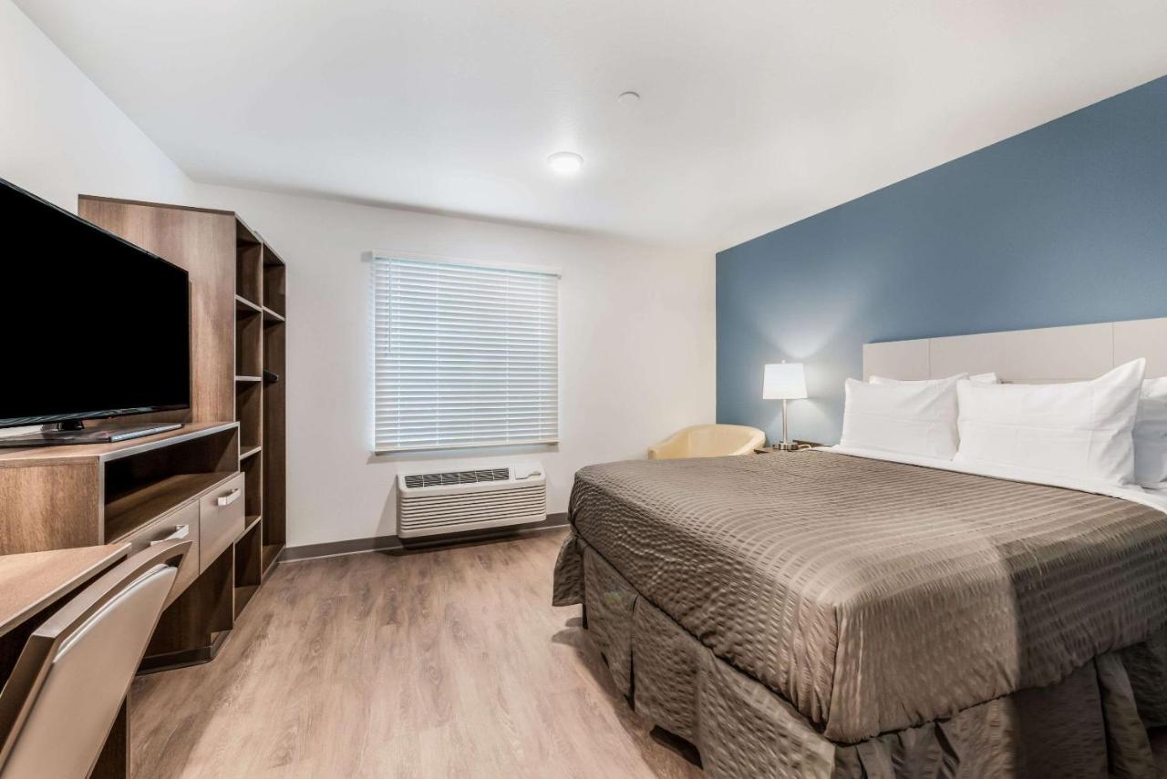 Queen Room with Roll-In Shower - Accessible/Non-Smoking at WoodSpring Suites Charlotte - University Research Park