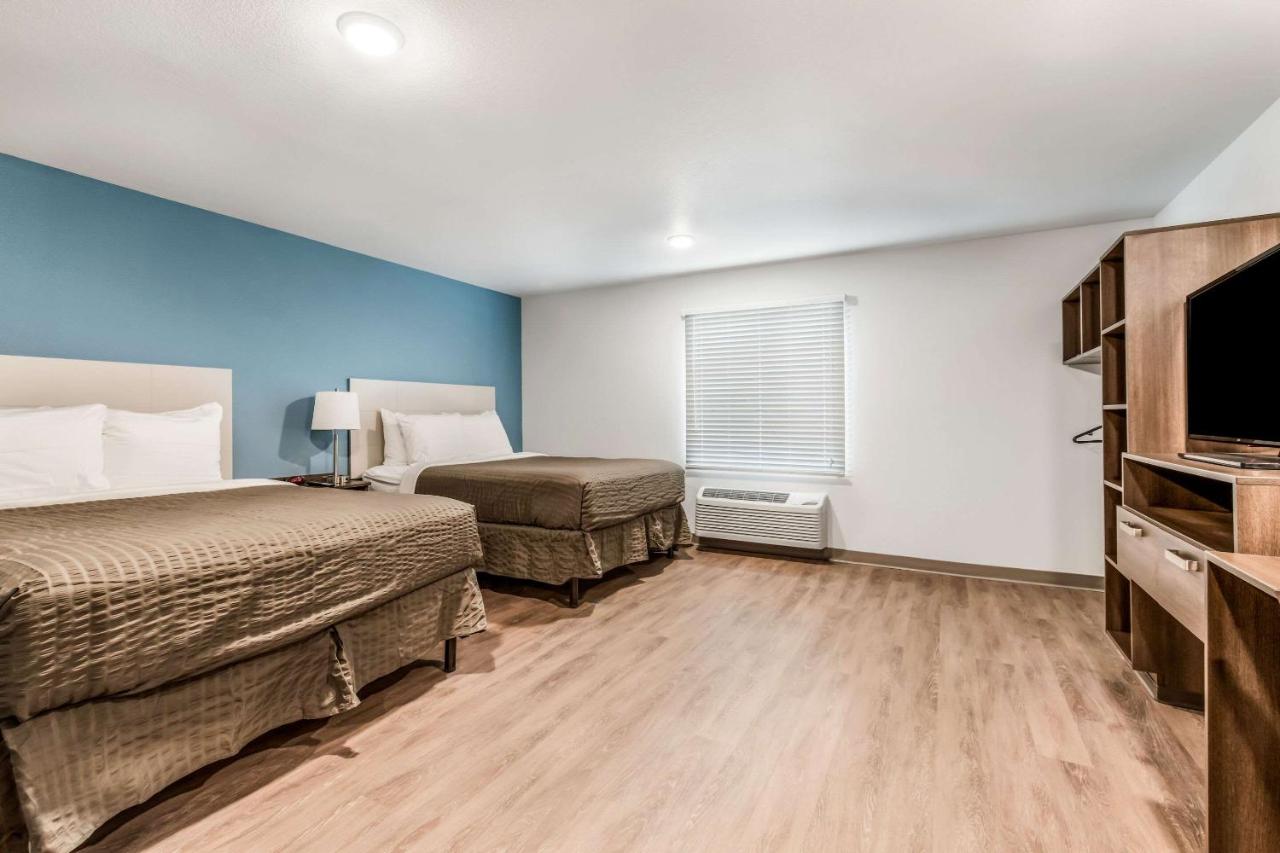 Queen Room with Two Queen Beds and Tub - Accessible/Non-Smoking at WoodSpring Suites Charlotte - University Research Park