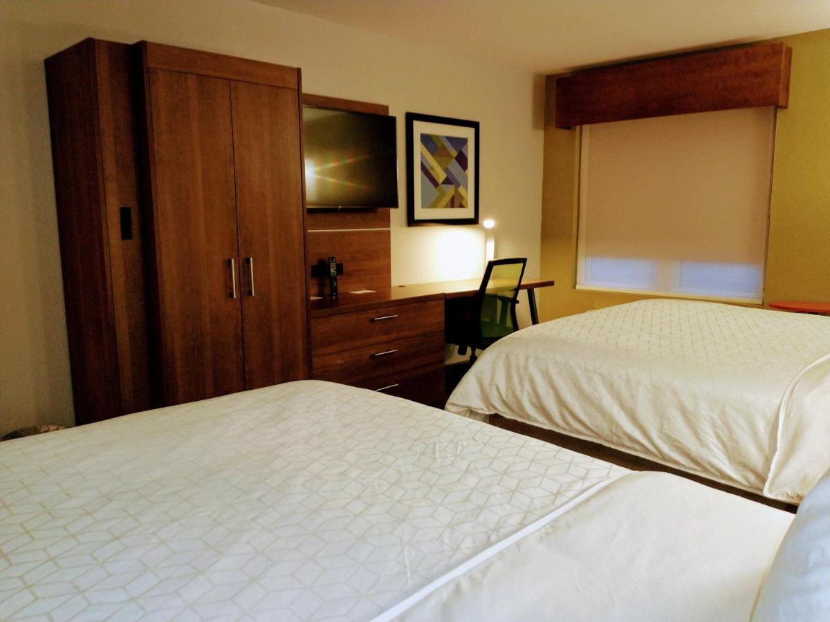 Queen Room with Two Queen Beds - Non-Smoking at Holiday Inn Express Hotel & Suites Madison by IHG