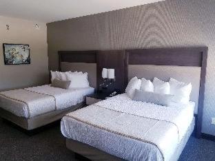 Room #638031936 at Best Western Plus Executive Residency Rigby's Water World Hotel