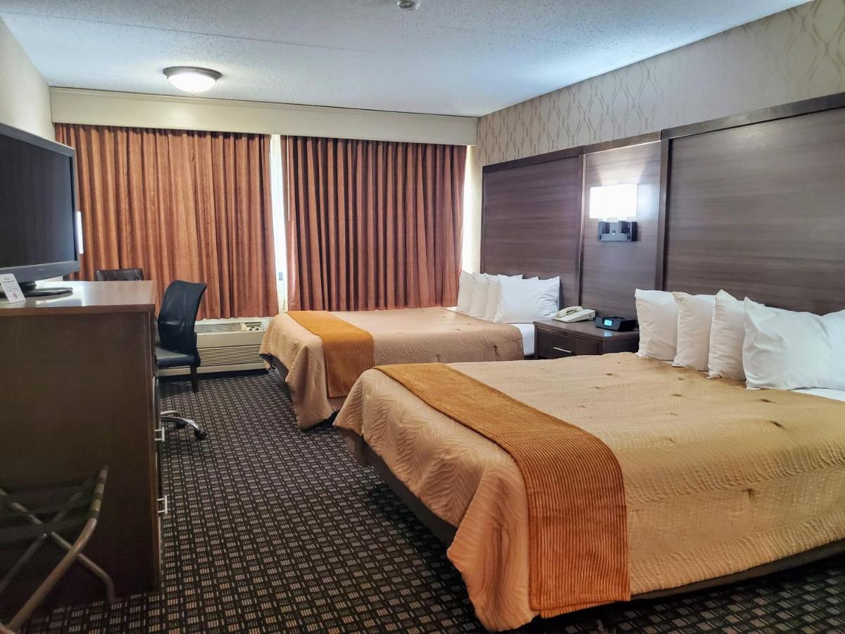 Queen Room with Two Queen Beds - Disability Access at AmericInn by Wyndham Watertown
