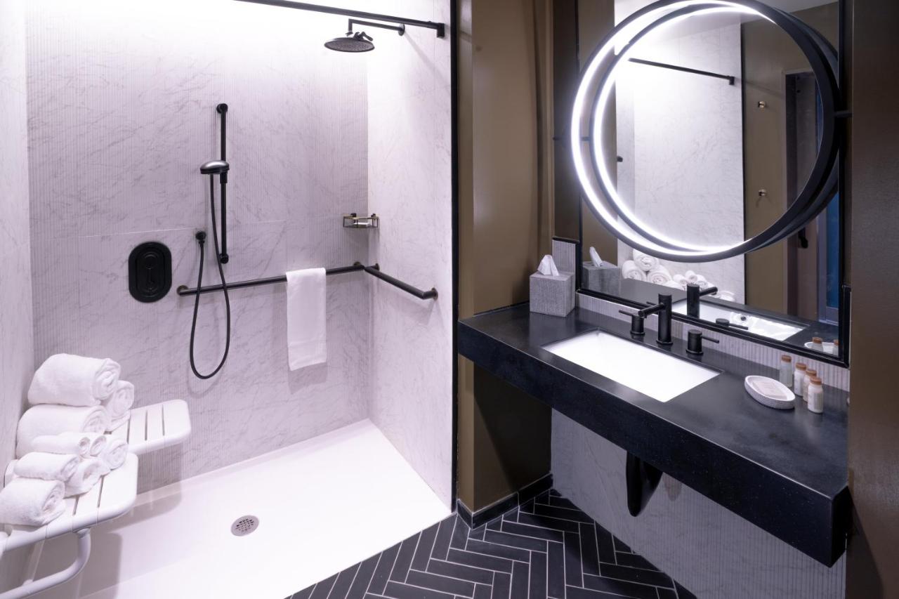 Queen Room with Two Queen Beds and Hearing Accessible Roll-In Shower - Non-Smoking at Hotel Indigo Columbus at Riverfront Place by IHG
