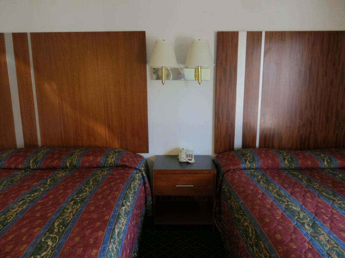 Queen Room with Two Queen Beds - Smoking at Riverside Inn & Suites