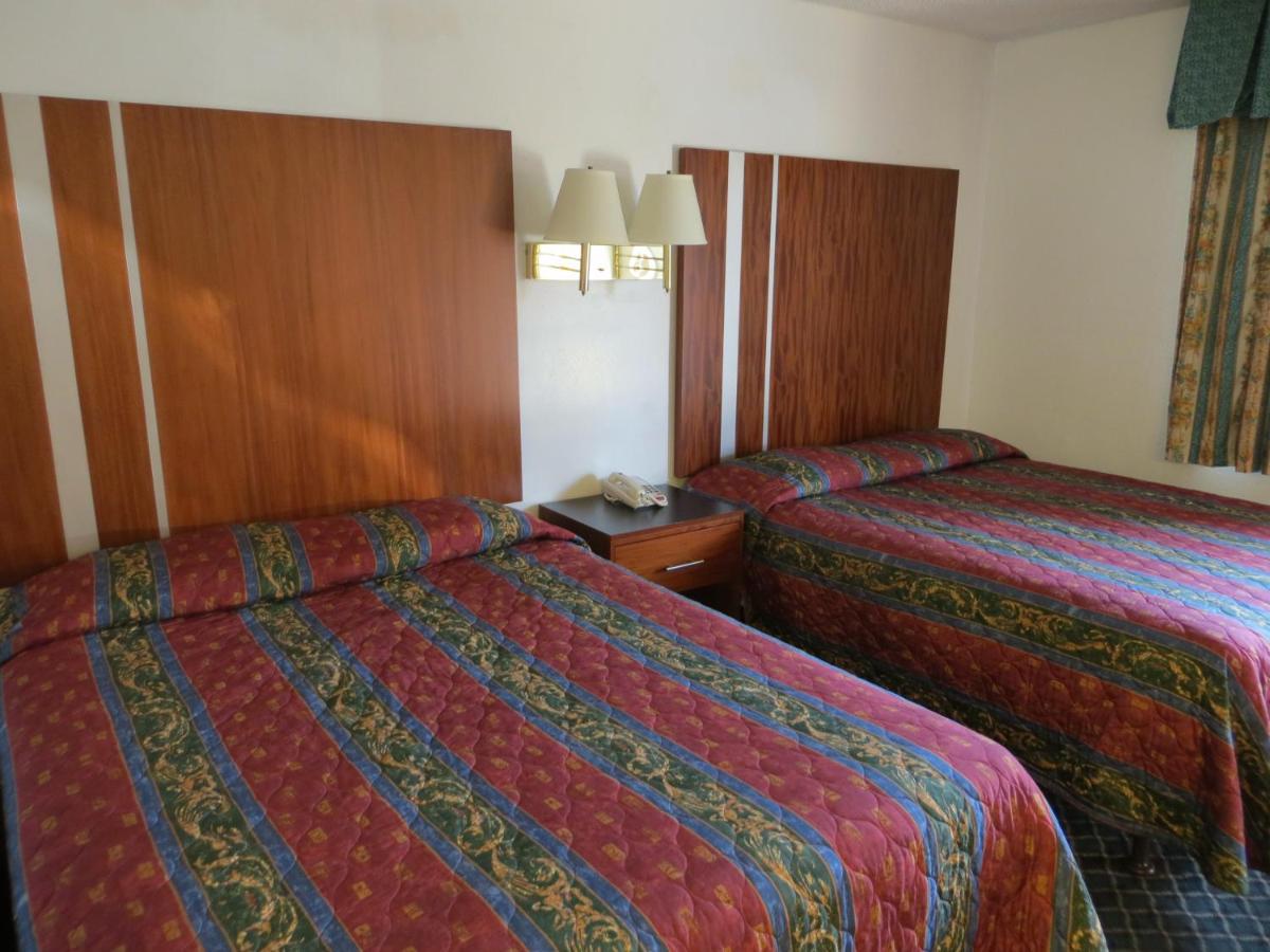 Queen Room with Two Queen Beds - Non-Smoking at Riverside Inn & Suites