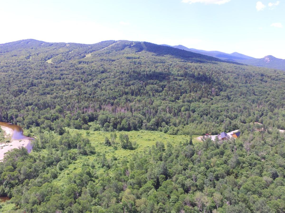 | BC Log cabin with private beach, river, fire pit, AC, wifi, onsite trails, ski slope views