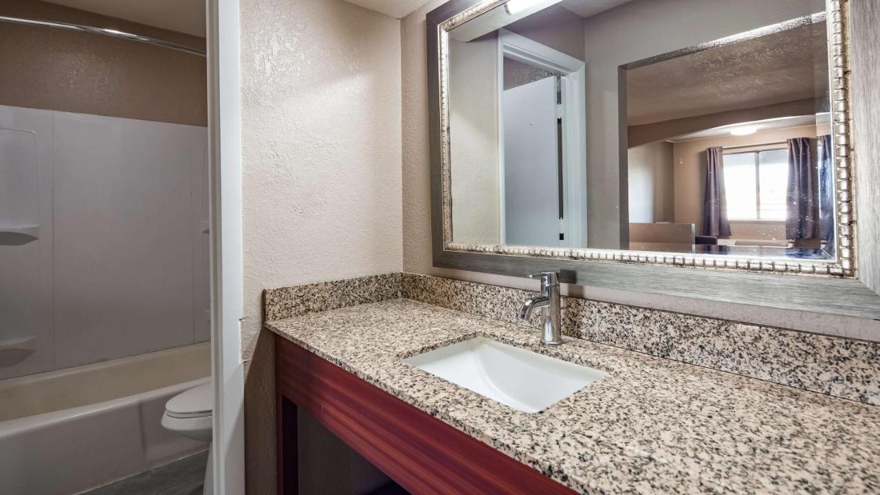Queen Room with Two Queen Beds at SureStay Hotel by Best Western Olathe