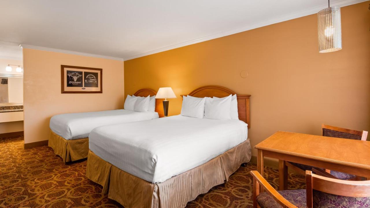 Queen Room with Two Queen Beds - Disability Access/Bath Tub at Sturgis Lodge & Suites, Travelodge by Wyndham