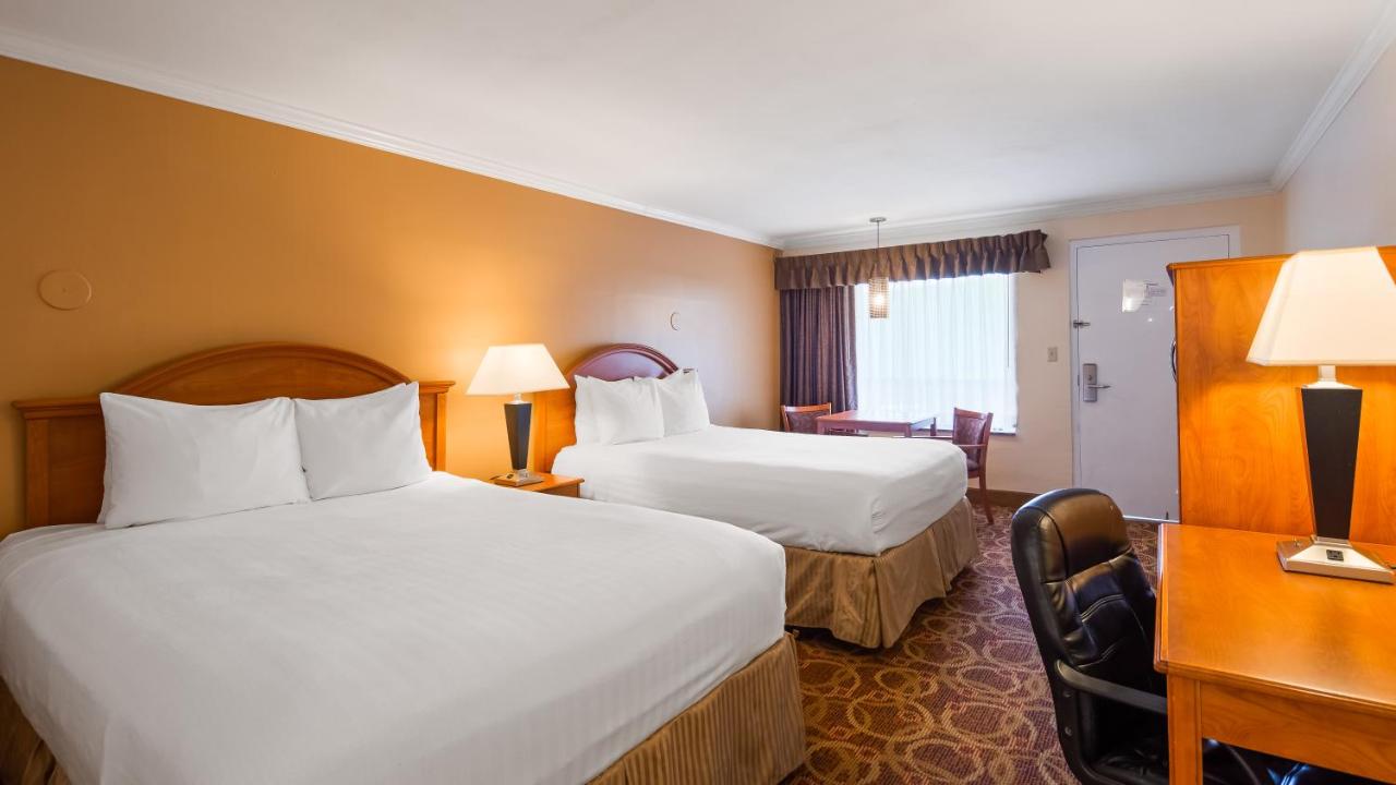 Queen Room with Two Queen Beds - Non-Smoking at Sturgis Lodge & Suites, Travelodge by Wyndham