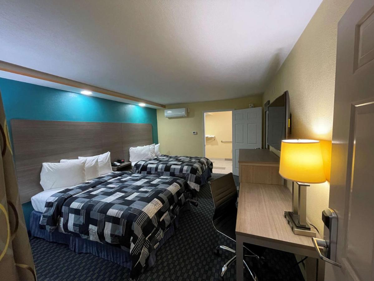 Double Room with Two Double Beds and Mobility Accessible Roll-In Shower at SureStay Plus Hotel by Best Western Odessa