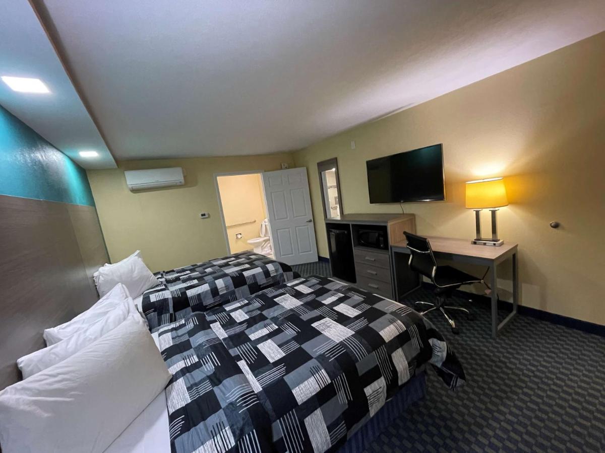 Double Room with Two Double Beds and Mobility Accessible Roll-In Shower at SureStay Plus Hotel by Best Western Odessa