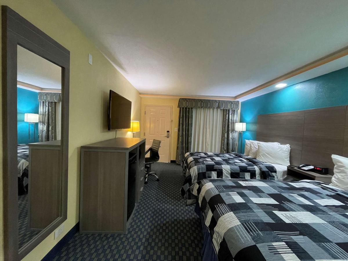 Double Room with Two Double Beds and Mobility Accessible Roll-In Shower at SureStay Plus Hotel by Best Western Odessa