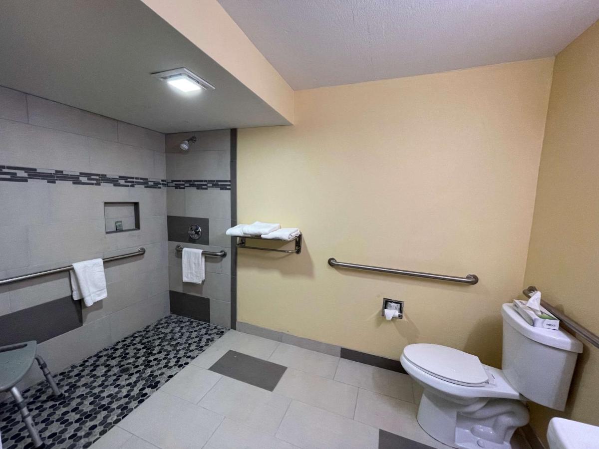 Double Room with Two Double Beds and Mobility Accessible Roll-In Shower at SureStay Plus Hotel by Best Western Odessa