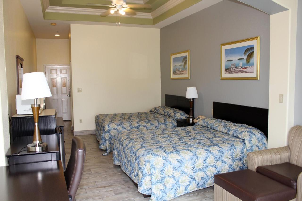 Queen Room with Pool View at Casa Bella Hotel and Suites