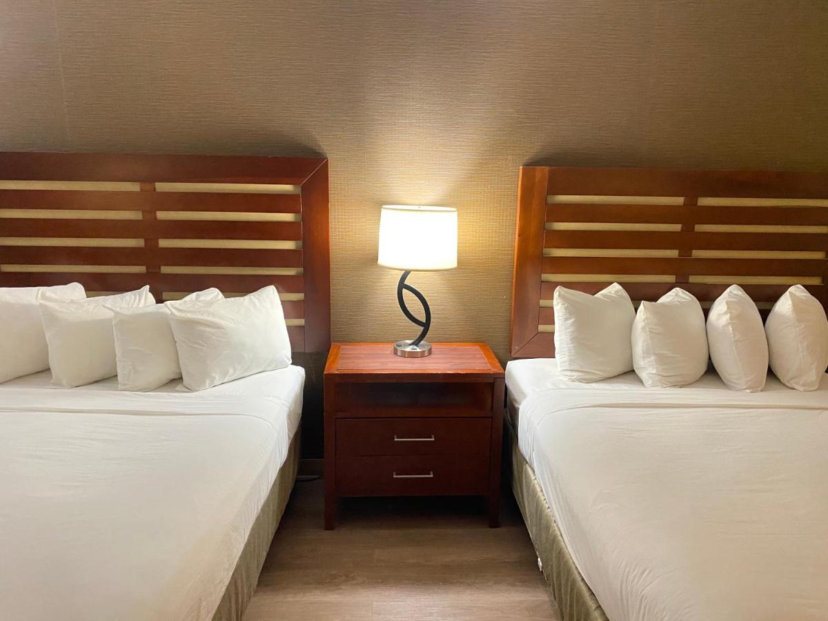 Queen Room with Two Queen Beds - Mobility Access/Non-Smoking at Wyndham Garden Grand Rapids Airport