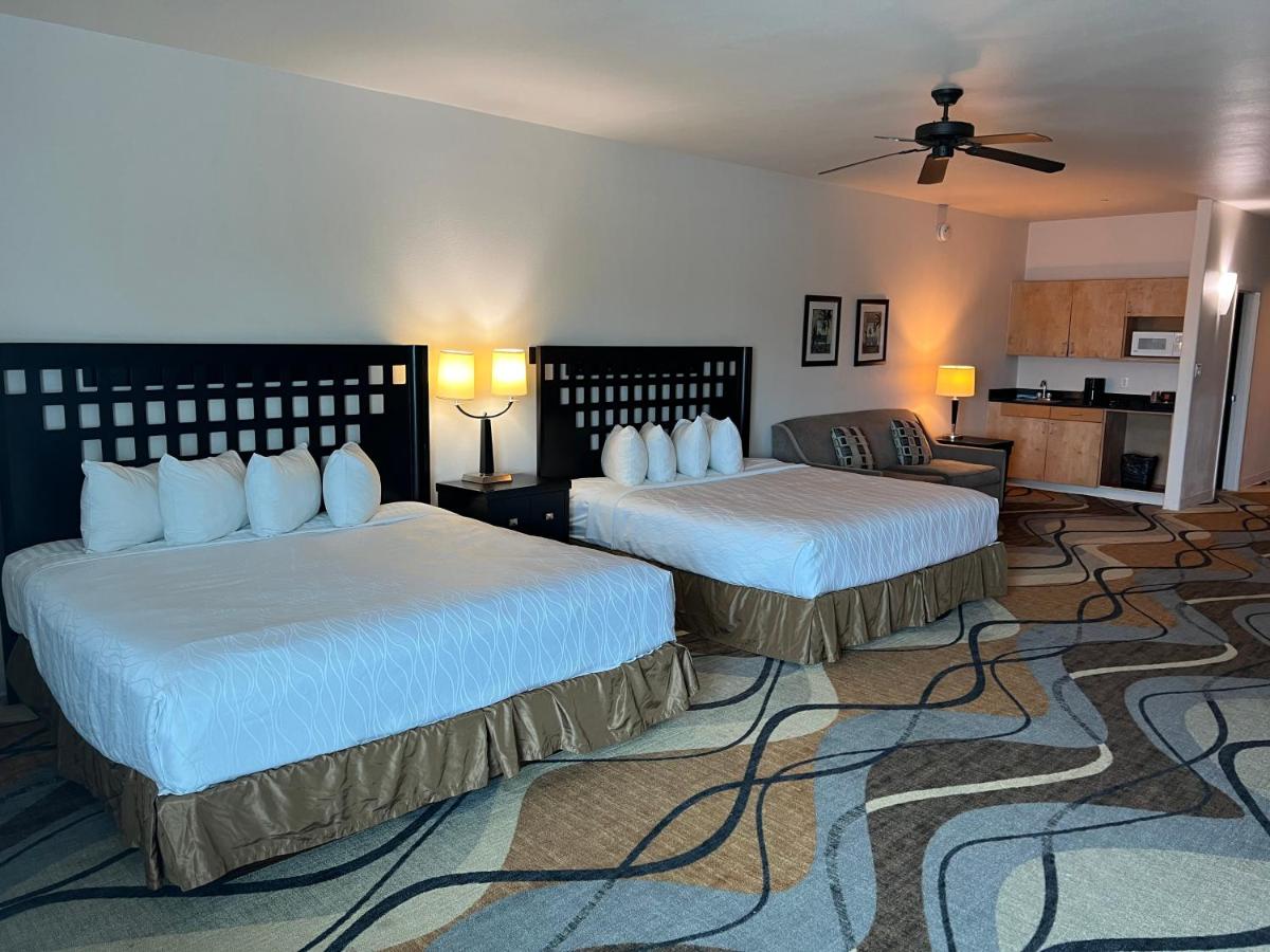 King Suite with Two King Beds and Sofa Bed at Sunchase Inn & Suites