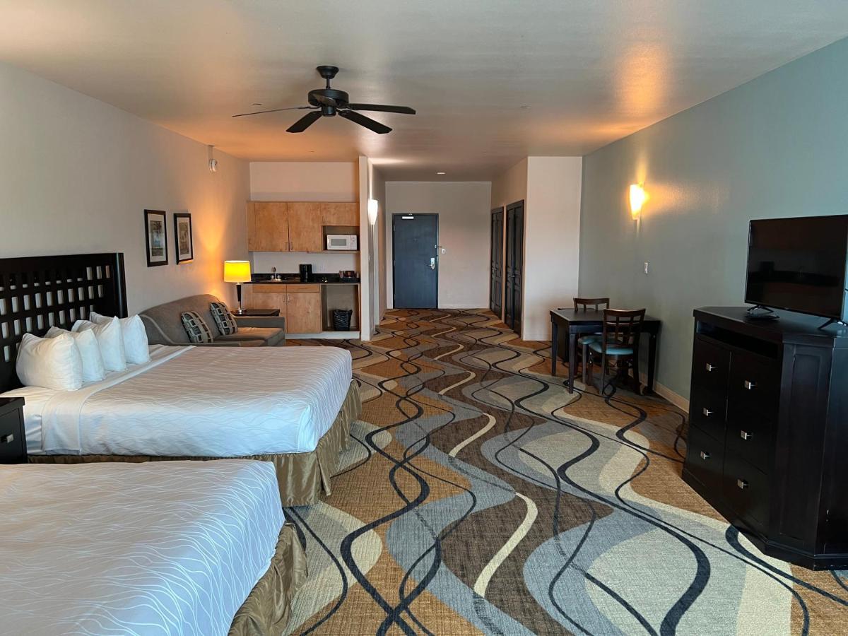 King Suite with Two King Beds and Sofa Bed at Sunchase Inn & Suites
