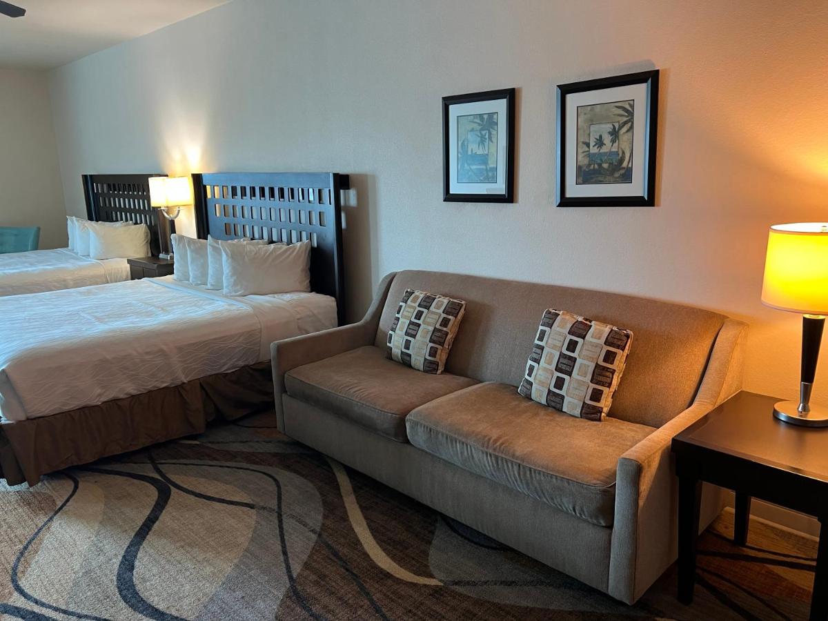 King Suite with Two King Beds and Sofa Bed at Sunchase Inn & Suites