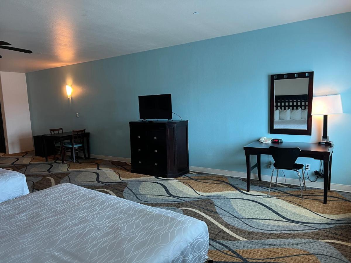 King Suite with Two King Beds and Sofa Bed at Sunchase Inn & Suites