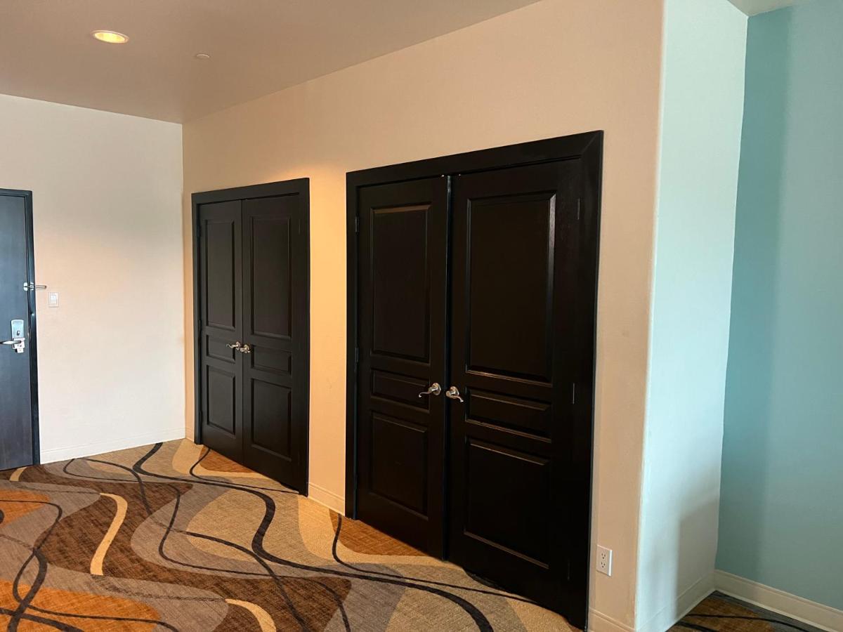 King Suite with Two King Beds and Sofa Bed at Sunchase Inn & Suites