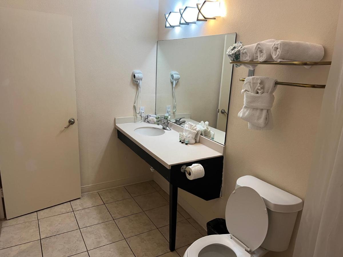 King Suite with Two King Beds and Sofa Bed at Sunchase Inn & Suites