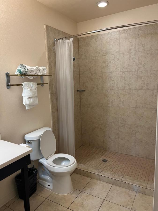 King Suite with Two King Beds and Sofa Bed at Sunchase Inn & Suites