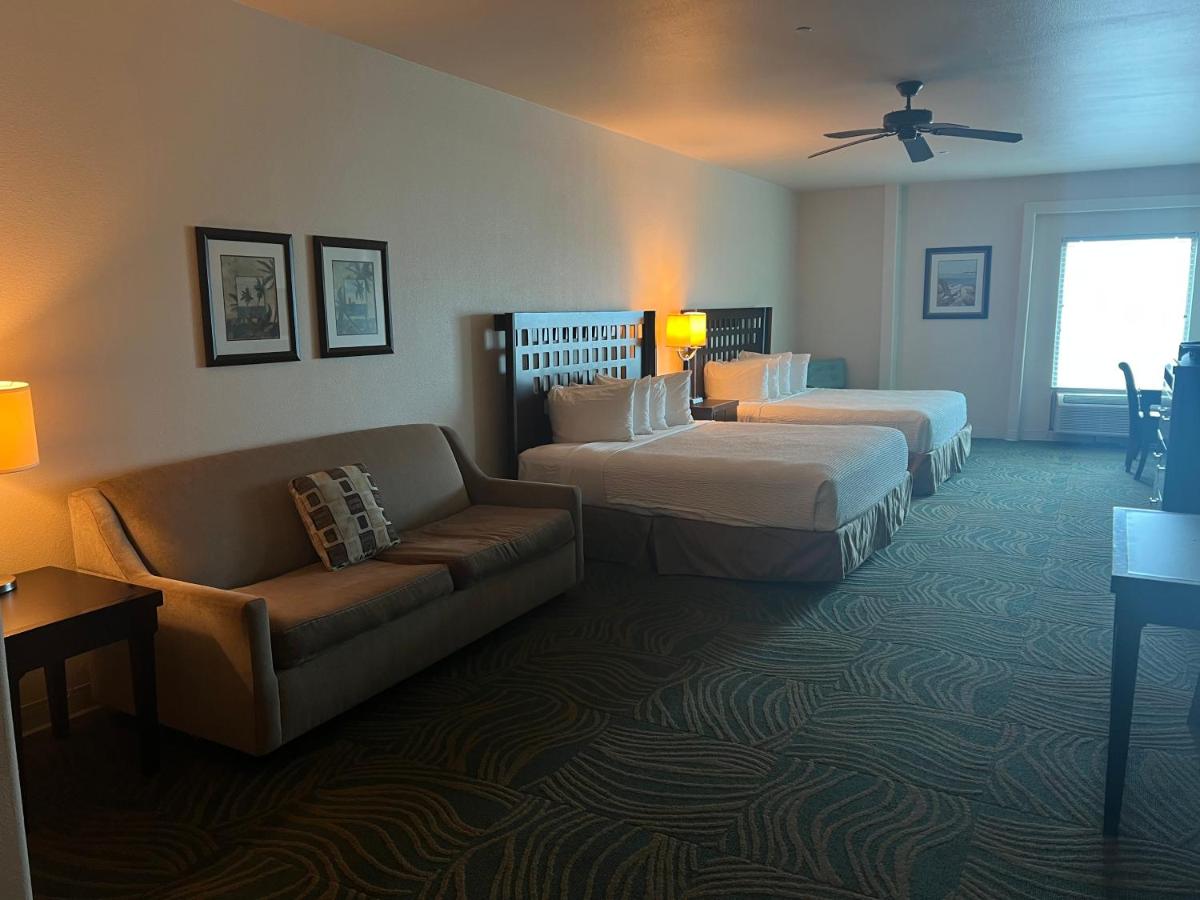 King Suite with Two King Beds and Sofa Bed at Sunchase Inn & Suites