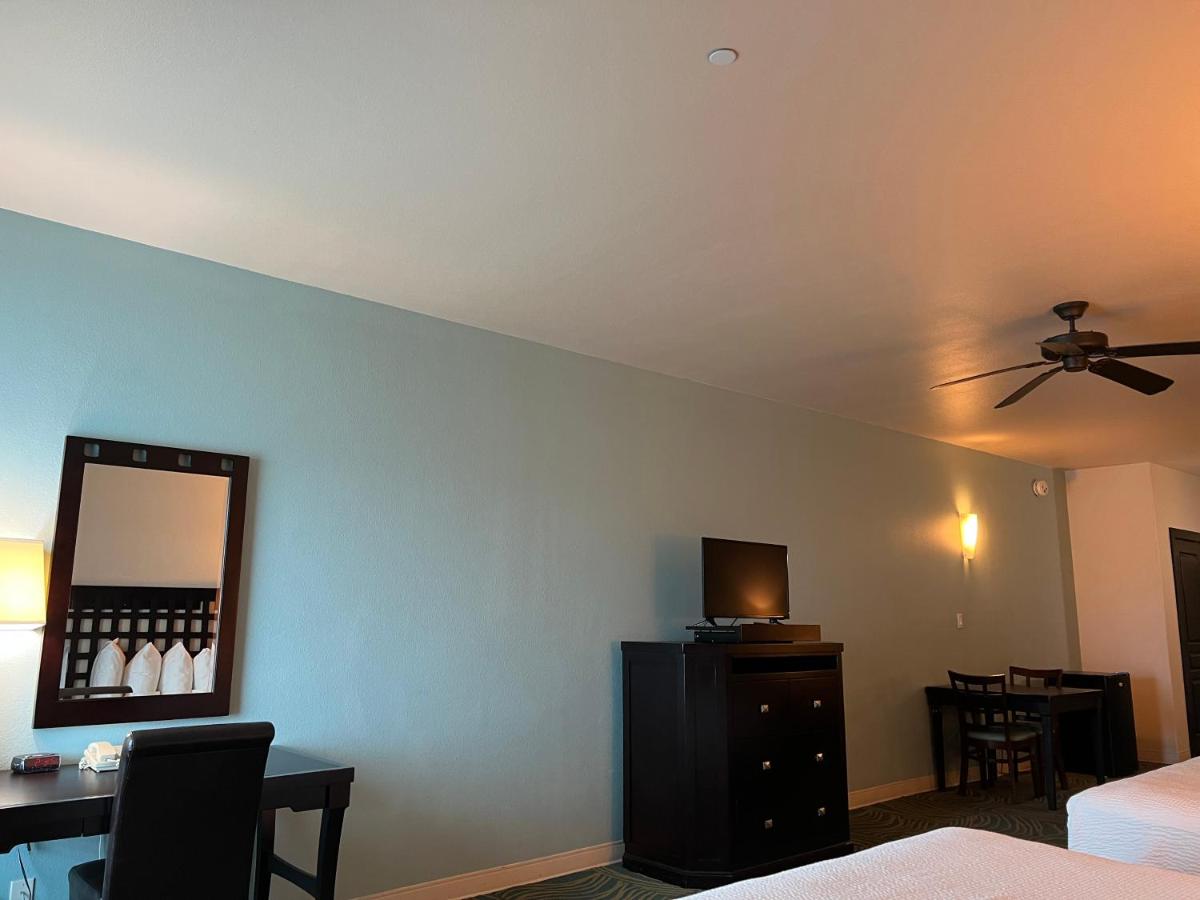 King Suite with Two King Beds and Sofa Bed at Sunchase Inn & Suites