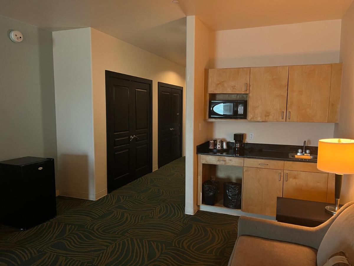 King Suite with Two King Beds and Sofa Bed at Sunchase Inn & Suites